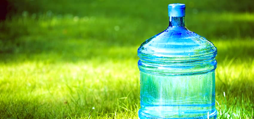 A Large Water Bottle on Grass